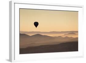 Single Hot Air Balloon over a Misty Dawn Sky, Cappadocia, Anatolia, Turkey, Asia Minor, Eurasia-David Clapp-Framed Photographic Print