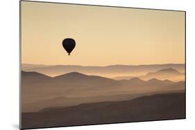 Single Hot Air Balloon over a Misty Dawn Sky, Cappadocia, Anatolia, Turkey, Asia Minor, Eurasia-David Clapp-Mounted Photographic Print