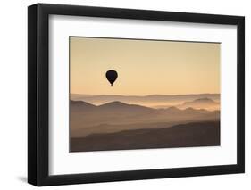 Single Hot Air Balloon over a Misty Dawn Sky, Cappadocia, Anatolia, Turkey, Asia Minor, Eurasia-David Clapp-Framed Photographic Print