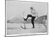 Sir Arthur Conan Doyle Demonstrating a Novice Turning Whilst Skiing in the Alps-null-Mounted Premium Photographic Print