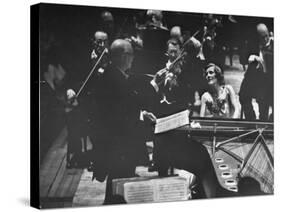 Sir Thomas Beecham Conducting Orchestra as Lady Beecham Plays Piano-Michael Rougier-Stretched Canvas