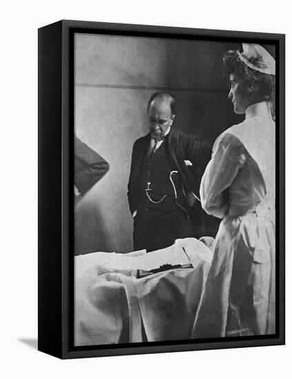 Sir William Osler Reading a Patient's Chart at Bedside as a Nurse Watches, Ca. 1903-null-Framed Stretched Canvas
