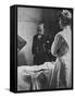 Sir William Osler Reading a Patient's Chart at Bedside as a Nurse Watches, Ca. 1903-null-Framed Stretched Canvas