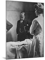 Sir William Osler Reading a Patient's Chart at Bedside as a Nurse Watches, Ca. 1903-null-Mounted Photo