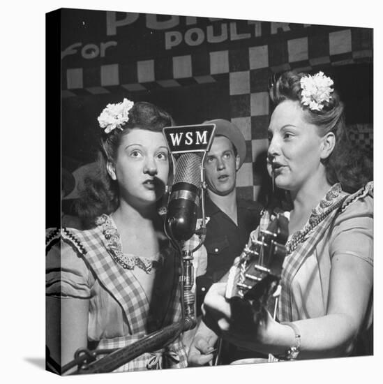 Sisters Performing at the Microphone at the Grand Ole Opry-Ed Clark-Stretched Canvas
