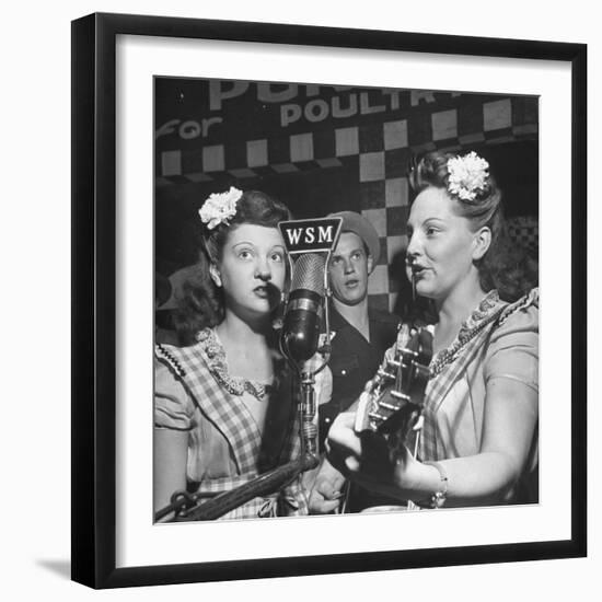 Sisters Performing at the Microphone at the Grand Ole Opry-Ed Clark-Framed Premium Photographic Print