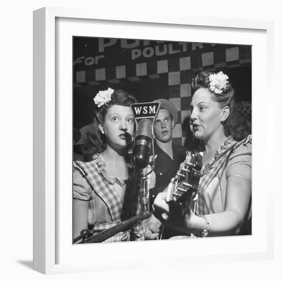 Sisters Performing at the Microphone at the Grand Ole Opry-Ed Clark-Framed Premium Photographic Print