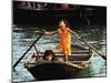 Sisters Who Live with Their Family on Halong Bay, Vietnam, Row Their Boat out to Greet Tourists-null-Mounted Premium Photographic Print