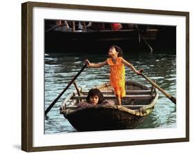 Sisters Who Live with Their Family on Halong Bay, Vietnam, Row Their Boat out to Greet Tourists-null-Framed Photographic Print