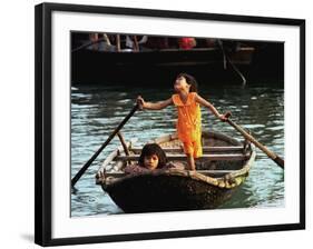 Sisters Who Live with Their Family on Halong Bay, Vietnam, Row Their Boat out to Greet Tourists-null-Framed Photographic Print