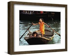 Sisters Who Live with Their Family on Halong Bay, Vietnam, Row Their Boat out to Greet Tourists-null-Framed Photographic Print