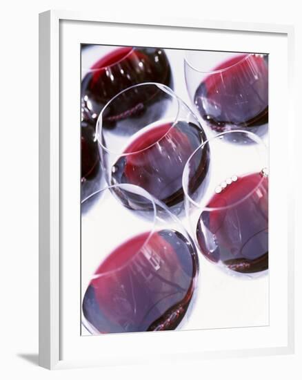 Six Glasses of Red Wine Against White Background-Linda Burgess-Framed Photographic Print