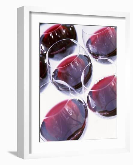 Six Glasses of Red Wine Against White Background-Linda Burgess-Framed Photographic Print