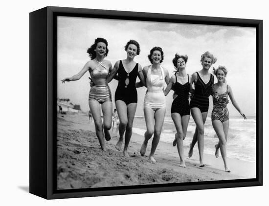 Six Women, in Swimsuits, Run in a Row Along a Beach, 1942-null-Framed Stretched Canvas