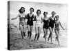 Six Women, in Swimsuits, Run in a Row Along a Beach, 1942-null-Stretched Canvas