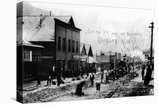 Skagway, Alaska - Laying Railroad Track on Broadway-Lantern Press-Stretched Canvas