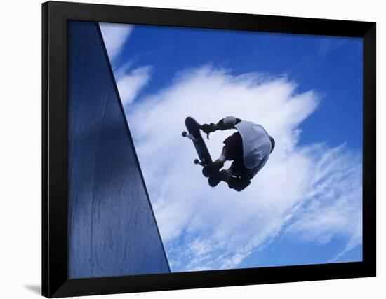 Skateboarder in Action over the Vert-null-Framed Photographic Print