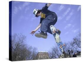 Skateboarder in Midair Doing a Trick-null-Stretched Canvas