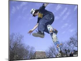 Skateboarder in Midair Doing a Trick-null-Mounted Premium Photographic Print