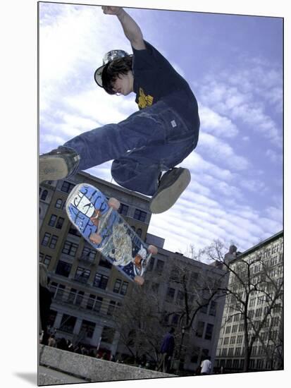 Skateboarder in Midair Doing a Trick-null-Mounted Photographic Print