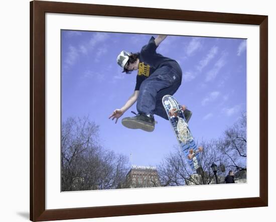 Skateboarder in Midair Doing a Trick-null-Framed Photographic Print