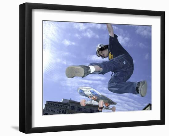 Skateboarder in Midair Doing a Trick-null-Framed Photographic Print