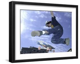 Skateboarder in Midair Doing a Trick-null-Framed Photographic Print