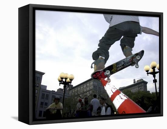 Skateboarder in Midair Knocking Over a Cone-null-Framed Stretched Canvas