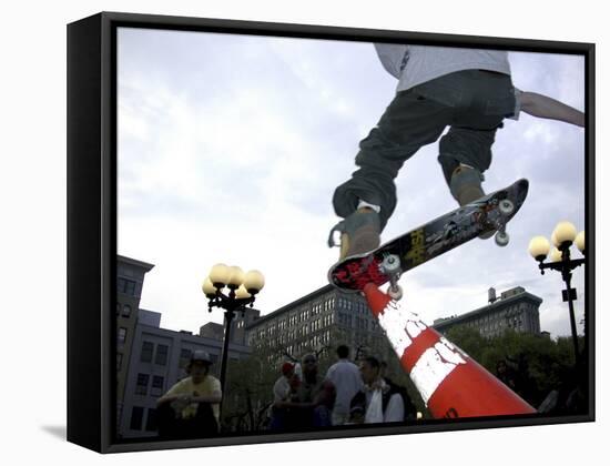 Skateboarder in Midair Knocking Over a Cone-null-Framed Stretched Canvas