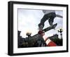 Skateboarder in Midair Knocking Over a Cone-null-Framed Premium Photographic Print