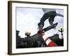 Skateboarder in Midair Knocking Over a Cone-null-Framed Photographic Print