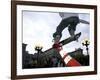 Skateboarder in Midair Knocking Over a Cone-null-Framed Photographic Print