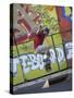 Skateboarder with Graffiti Background-null-Stretched Canvas