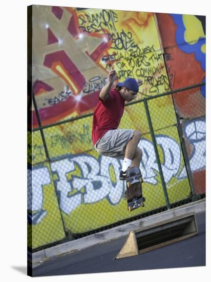 Skateboarder with Graffiti Background-null-Stretched Canvas
