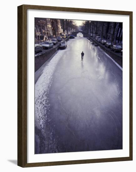 Skater on Frozen Canal, Amsterdam, Netherlands-Michele Molinari-Framed Premium Photographic Print