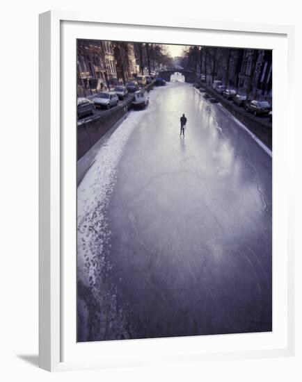 Skater on Frozen Canal, Amsterdam, Netherlands-Michele Molinari-Framed Premium Photographic Print