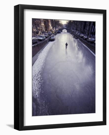 Skater on Frozen Canal, Amsterdam, Netherlands-Michele Molinari-Framed Photographic Print