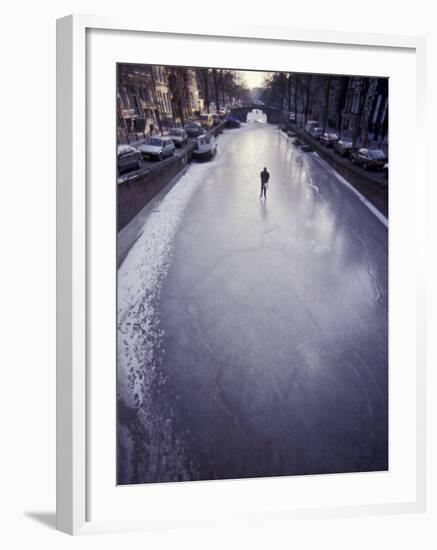 Skater on Frozen Canal, Amsterdam, Netherlands-Michele Molinari-Framed Photographic Print