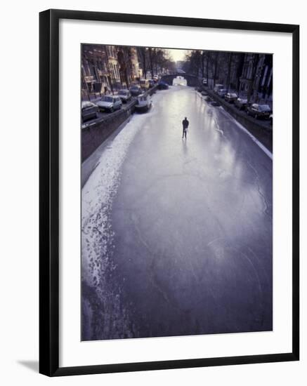 Skater on Frozen Canal, Amsterdam, Netherlands-Michele Molinari-Framed Photographic Print