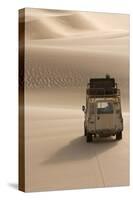 Skeleton Coast, Namibia. Land Rover Venturing Out over the Sand Dunes-Janet Muir-Stretched Canvas