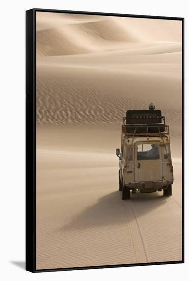 Skeleton Coast, Namibia. Land Rover Venturing Out over the Sand Dunes-Janet Muir-Framed Stretched Canvas