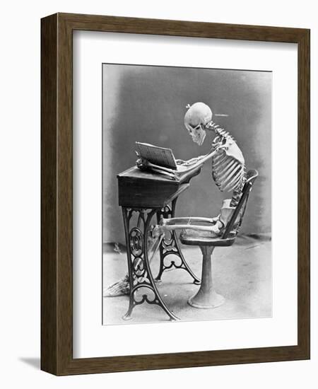 Skeleton Reading at Desk-Bettmann-Framed Photographic Print