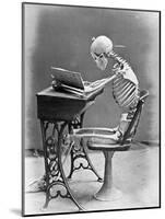 Skeleton Reading at Desk-Bettmann-Mounted Photographic Print