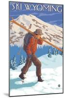 Skier Carrying Snow Skis, Wyoming-Lantern Press-Mounted Art Print