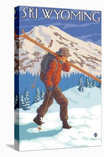 Skier Carrying Snow Skis, Wyoming-Lantern Press-Stretched Canvas