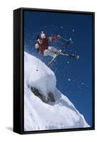 Skier in Mid-Air Above Snow on Ski Slopes-null-Framed Stretched Canvas