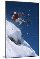 Skier in Mid-Air Above Snow on Ski Slopes-null-Mounted Photo