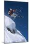 Skier in Mid-Air Above Snow on Ski Slopes-null-Mounted Photo