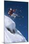 Skier in Mid-Air Above Snow on Ski Slopes-null-Mounted Photo