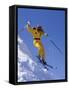 Skier in Yellow Against a Blue Sky-null-Framed Stretched Canvas